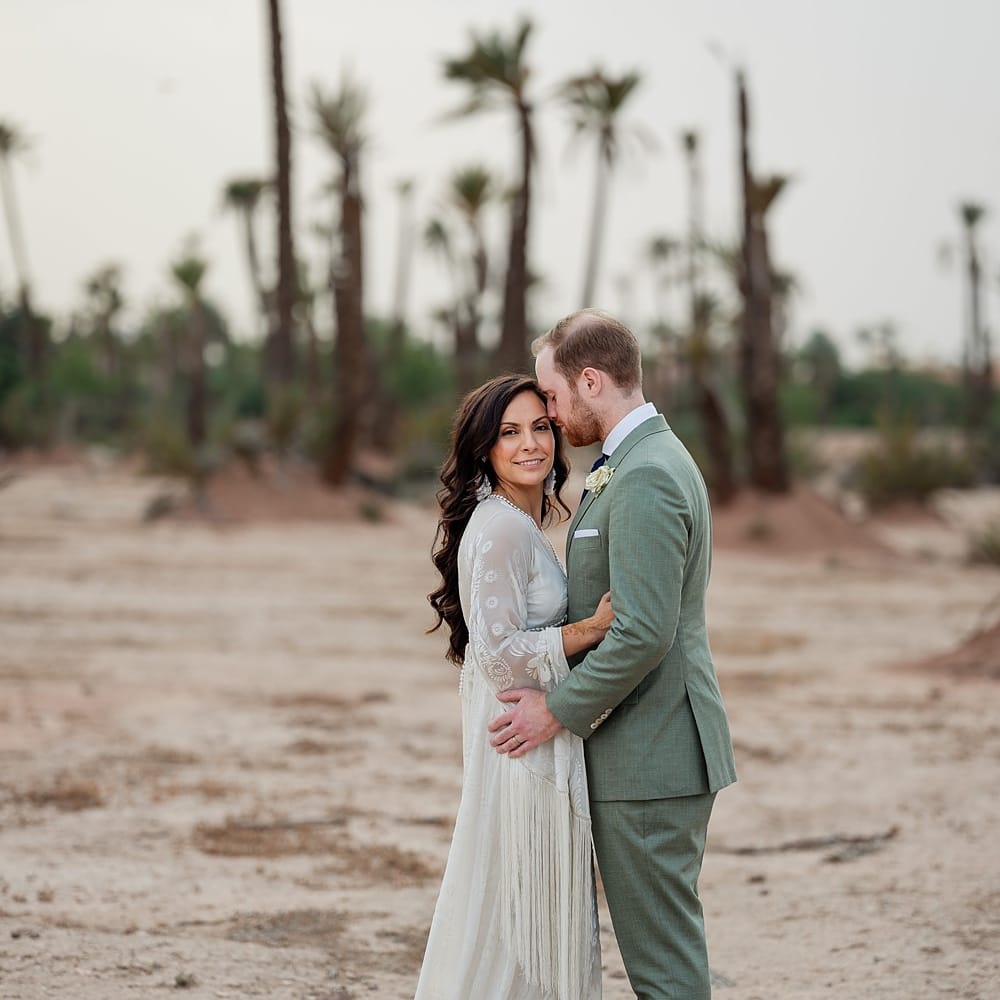 Bride in Rue de Seine Bridal Gown | Groom in Green Beggars Run Suit | Paradise Destination Wedding at Jnane Tamsna in Marrakech, Morocco | Nordica Photography | Matteo Castelluccia Film