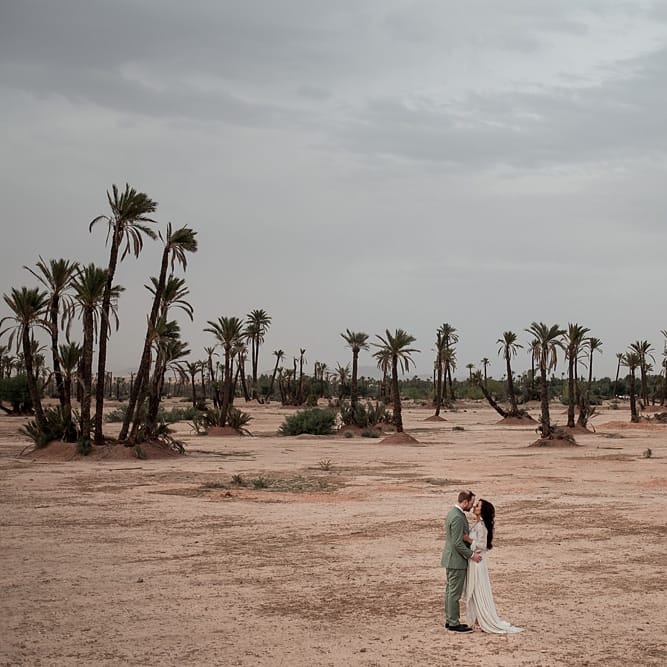 Bride in rue de Seine Bridal Gown | Groom in Green Beggars Run Suit | Paradise Destination Wedding at Jnane Tamsna in Marrakech, Morocco | Nordica Photography | Matteo Castelluccia Film