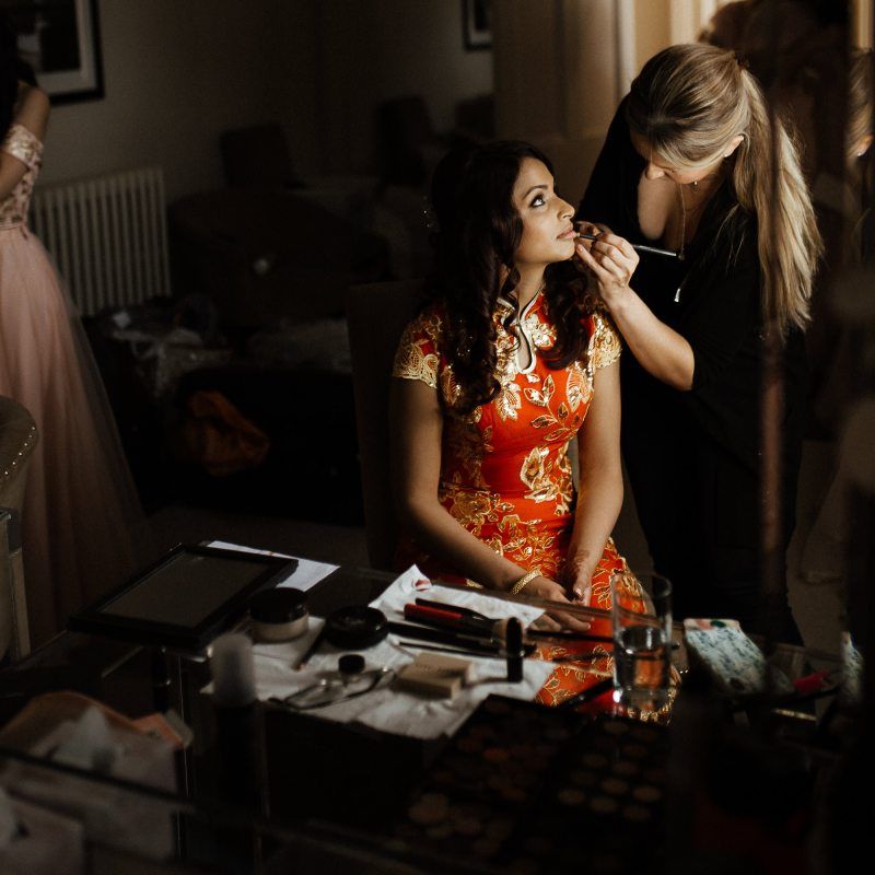 Bridal beauty before Chinese tea ceremony and outfit change to Indian wedding dress