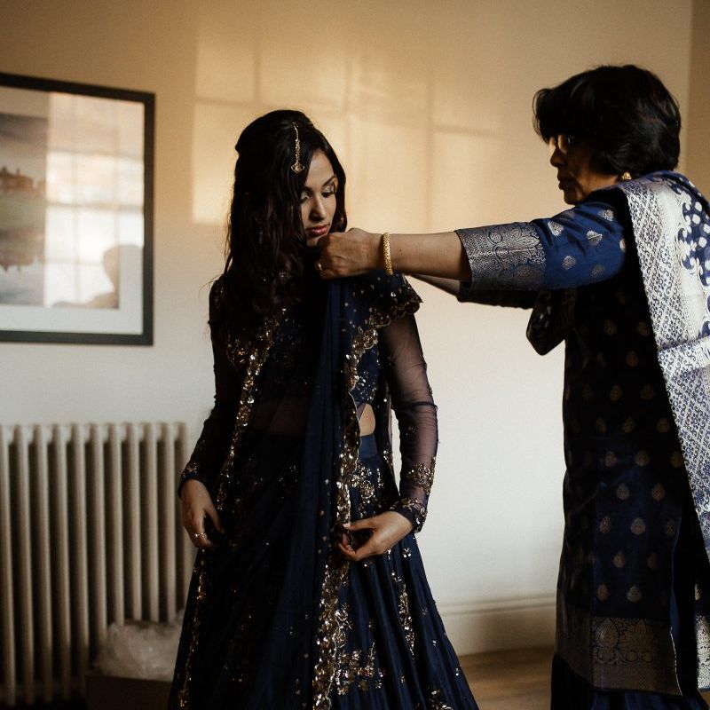 Bride changes into navy Indian wedding dress