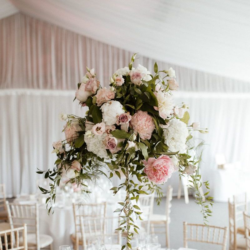 Pink wedding flower centrepieces at fusion wedding