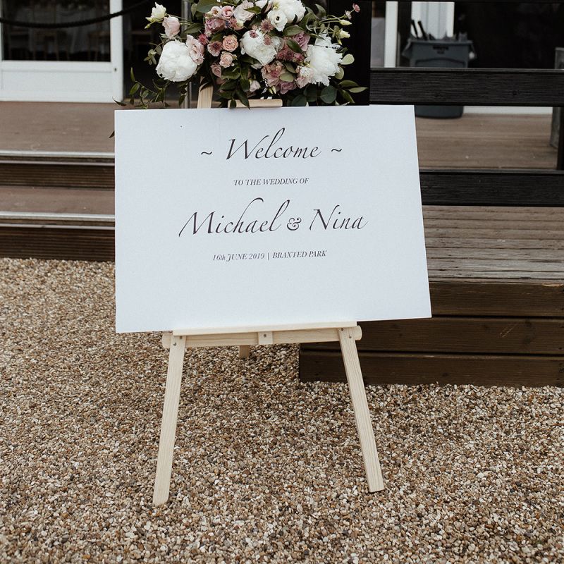 Wedding welcome sign with pink wedding flowers