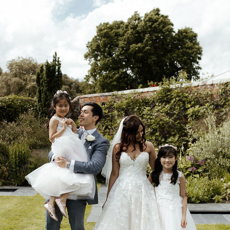 Flower girls with the bride and groom