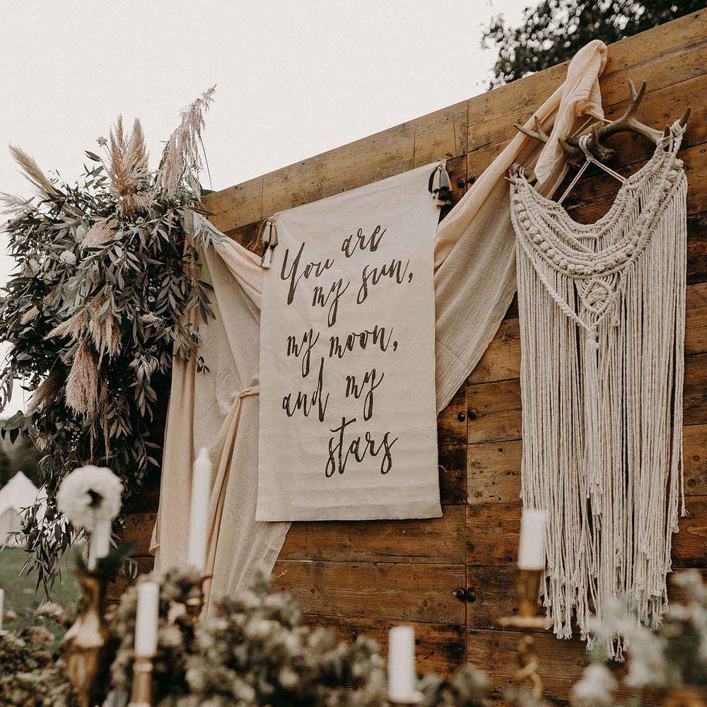 Rustic Tablescape with Drapes, Fabric Flag Backdrop, Dried Flowers &amp; Macrame Hanging | Nude Bohemian Wedding Inspiration by Wonderland Invites &amp; Rock The Day Styling | Kelsie Low Photography