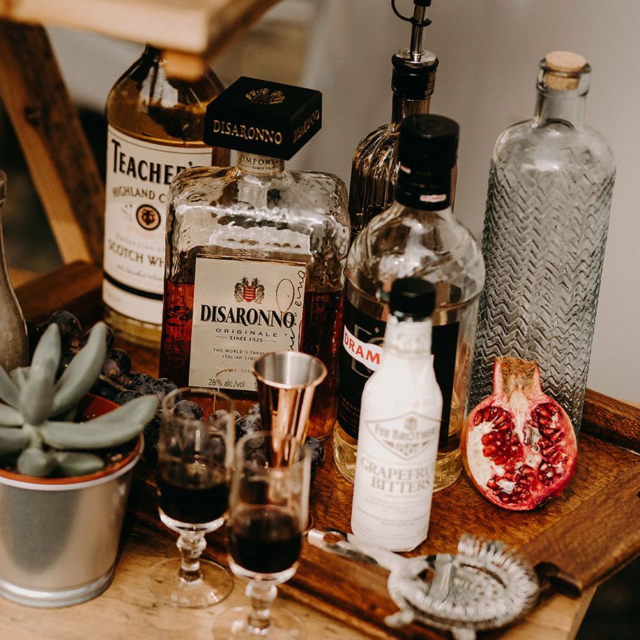 Liquor Station with Succulent Plant Pot Decor | Nude Bohemian Wedding Inspiration by Wonderland Invites &amp; Rock The Day Styling | Kelsie Low Photography