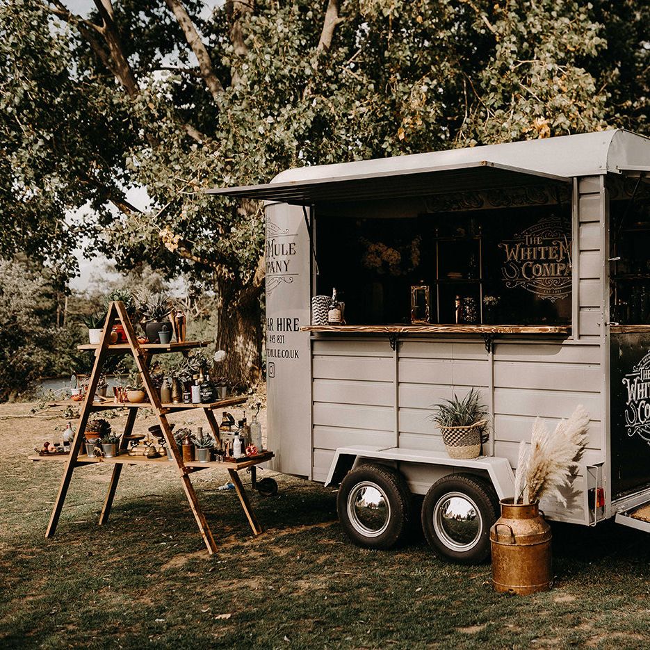 The White Mule Drinks Trailer with vintage Step Ladder Shelving Display | Nude Bohemian Wedding Inspiration by Wonderland Invites &amp; Rock The Day Styling | Kelsie Low Photography