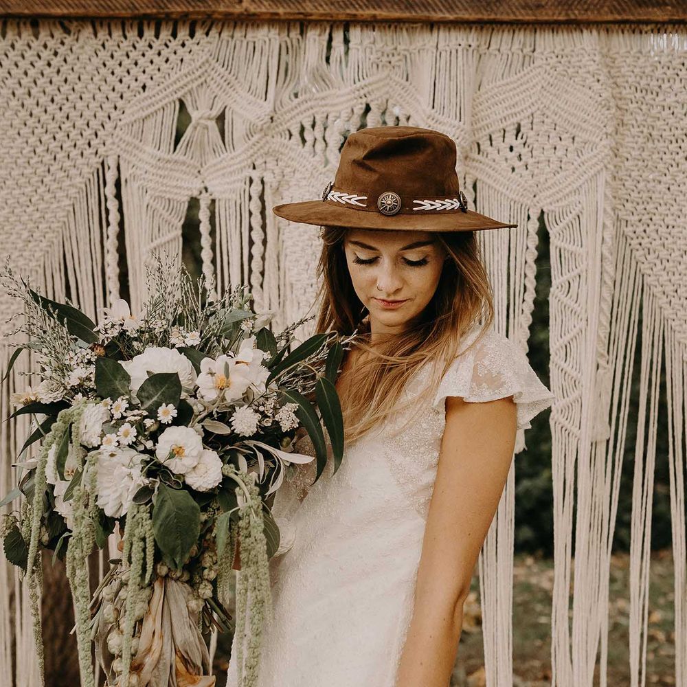 Boho Bride in Hat &amp; Lace Rock The Frock Bridal Gown | Macrame Wall Hanging &amp; Dried Flowers | Nude Bohemian Wedding Inspiration by Wonderland Invites &amp; Rock The Day Styling | Kelsie Low Photography