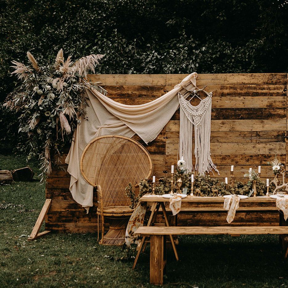 Wooden Backdrop with Drapes, Dried Flowers &amp; Macrame Decor | Wooden Table with Candle Sticks &amp; Greenery Garland | Nude Bohemian Wedding Inspiration by Wonderland Invites &amp; Rock The Day Styling | Kelsie Low Photography