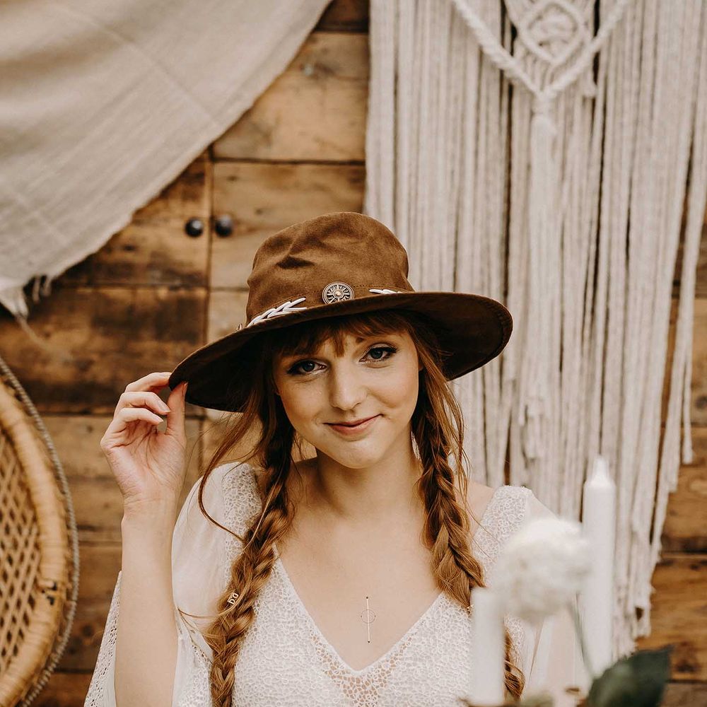 Boho Bride in Lace Dress &amp; Hat | Drapes, Dried Flowers &amp; Macrame Decor | Wooden Table with Candle Sticks &amp; Greenery Garland | Nude Bohemian Wedding Inspiration by Wonderland Invites &amp; Rock The Day Styling | Kelsie Low Photography