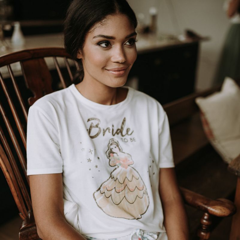 beautiful bride in 'bride' t shirt on wedding morning