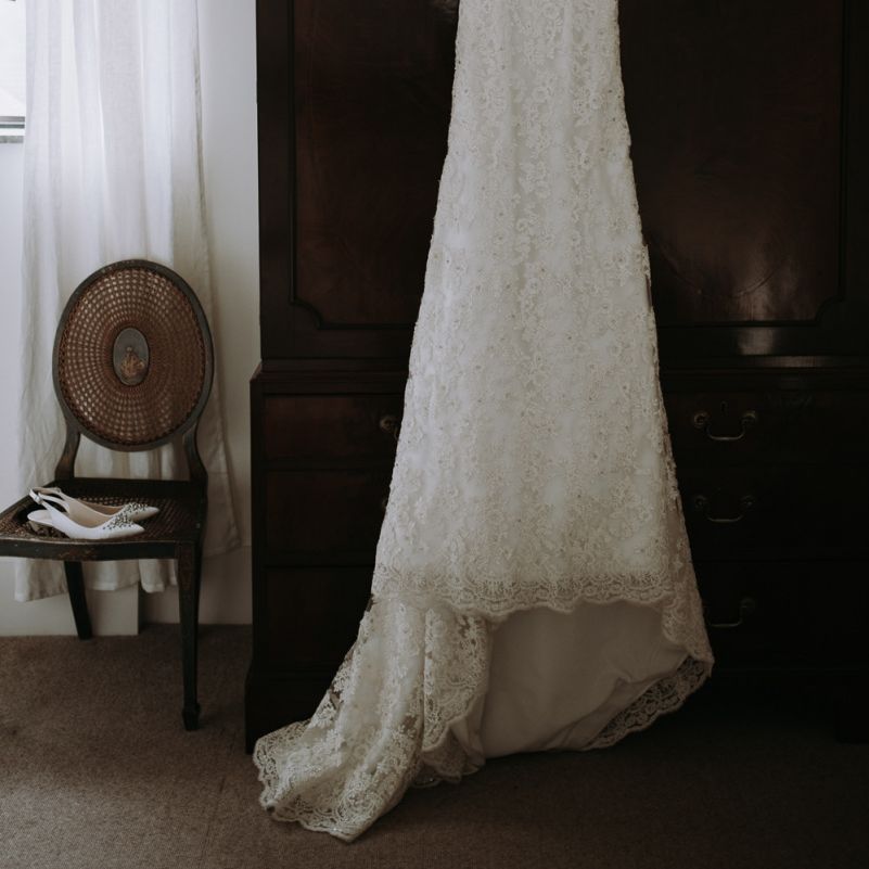 Lilliana couture lace wedding dress with couple using a home  garden for wedding