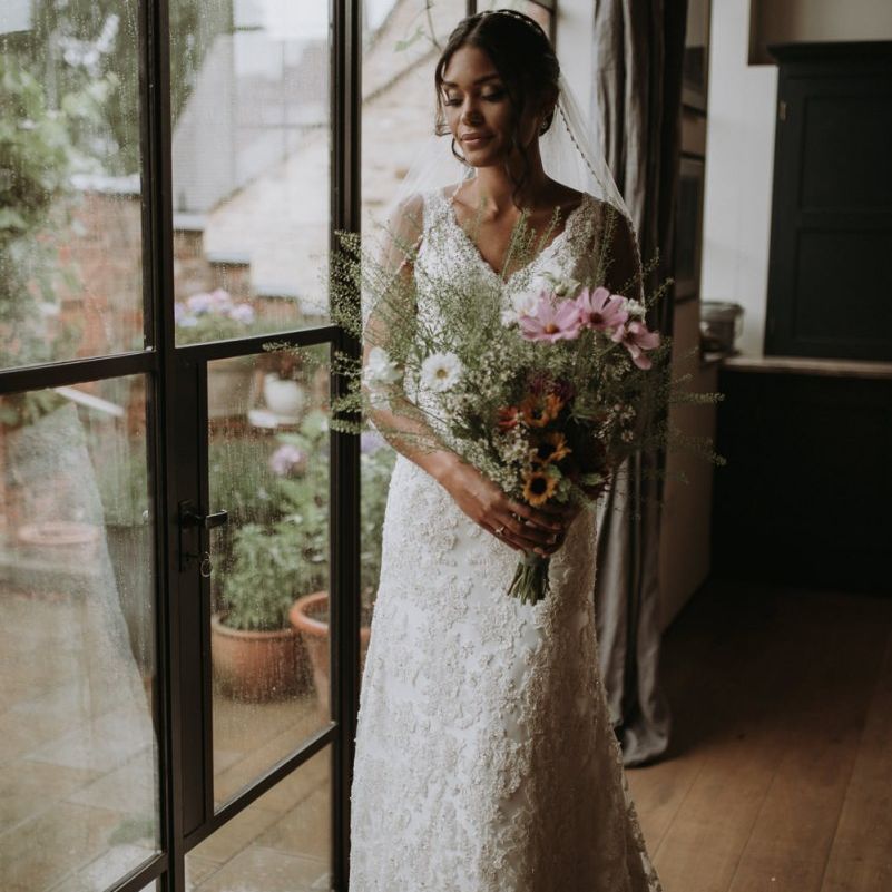 Bride in lace Liliana Couture wedding dress