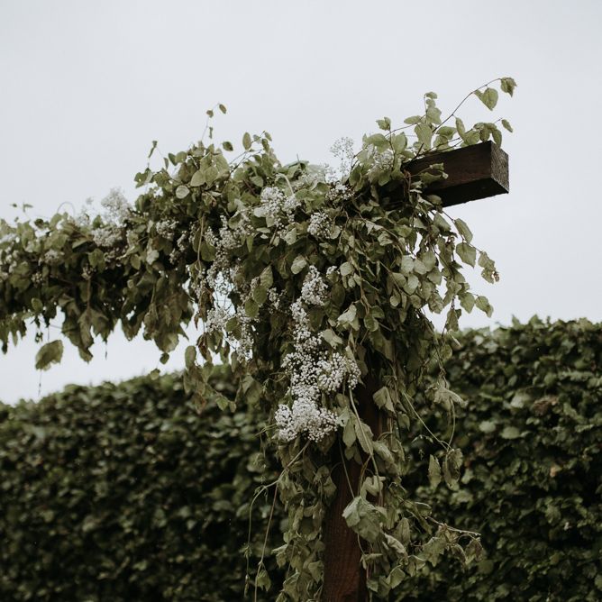 Flower cover wooden altarat home using garden for wedding ceremony