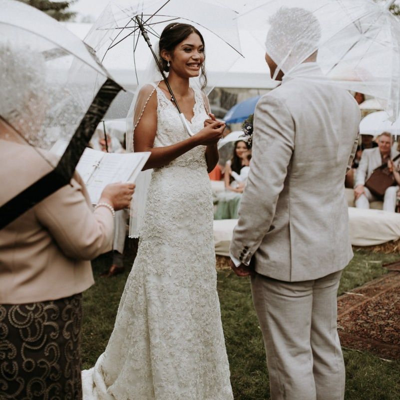Bride and groom exchanging vows at home garden wedding ceremony