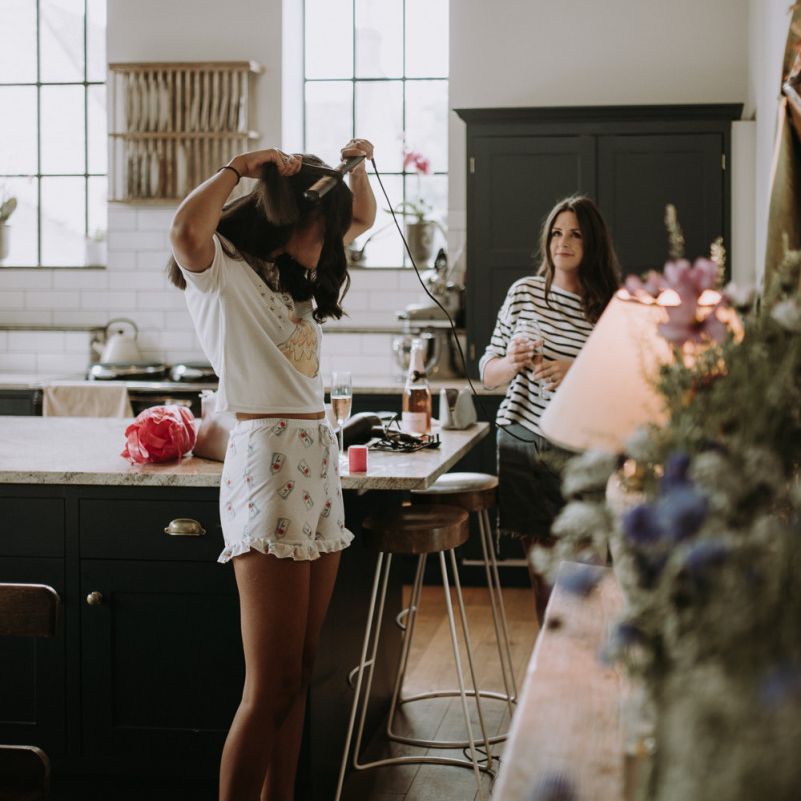 Wedding morning bridal preparations at home using garden for wedding ceremony