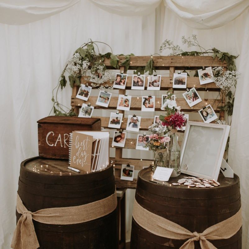 Rustic barrel card and guest book table at garden for wedding reception