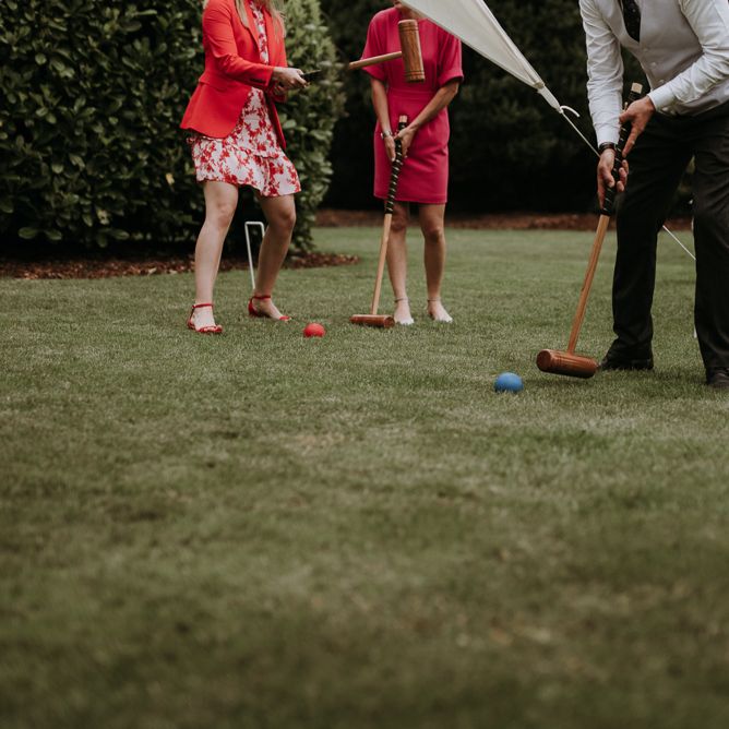 wedding guests playing garden games