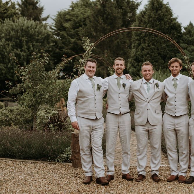 Groomsmen in beige wedding suits