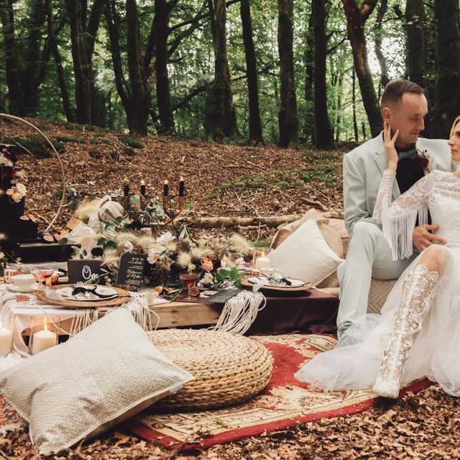 Bride in Long Sleeve Wedding Dress with Fringe Detail and White Lace Boots