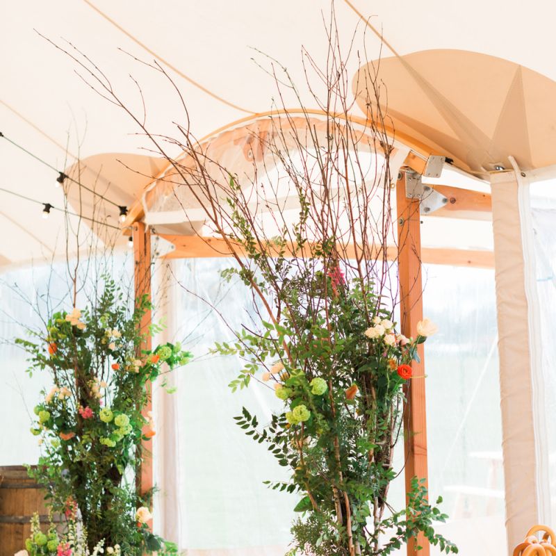 Tall Flower Arrangement Entrance to PapaKåta Sperry Tent Wedding
