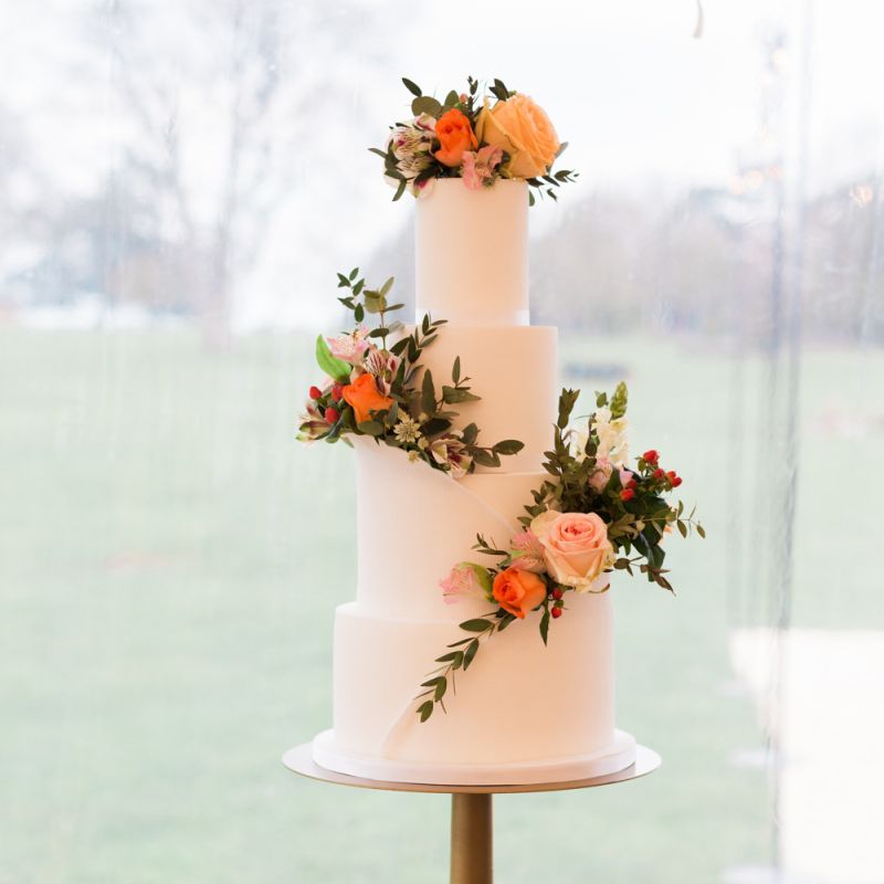 Three Tier Wedding Cake with Coral and Peach Wedding Flower Decor