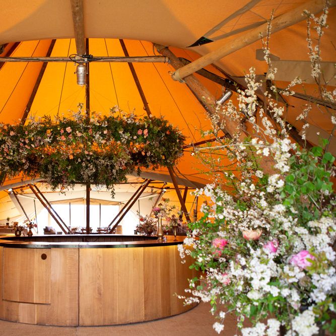 Circular Bar with Floral Hoop Canopy and Floral Arrangements