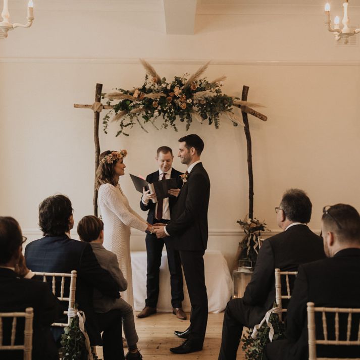 Floral boho aisle decor at Linden House for  intimate wedding with bride wearing vintage dress and flower crown
