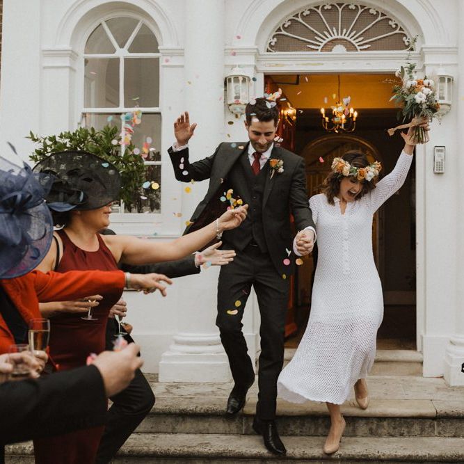 Couple say 'I do' at Linden House wedding with modern style boho decor
