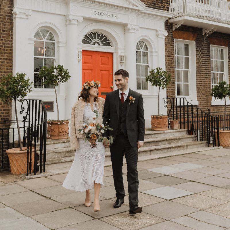 Bride wearing 70s vintage dress and faux fur jacket at Linden House wedding ceremony