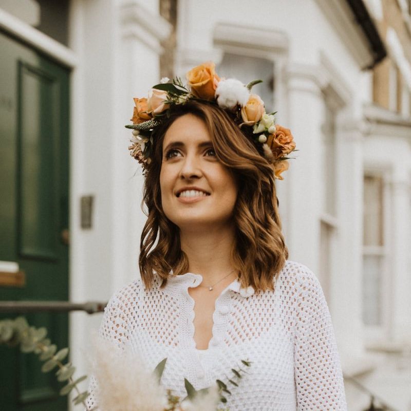 Bride wearing  roses and cotton flower floral crown teamed with vintage dress