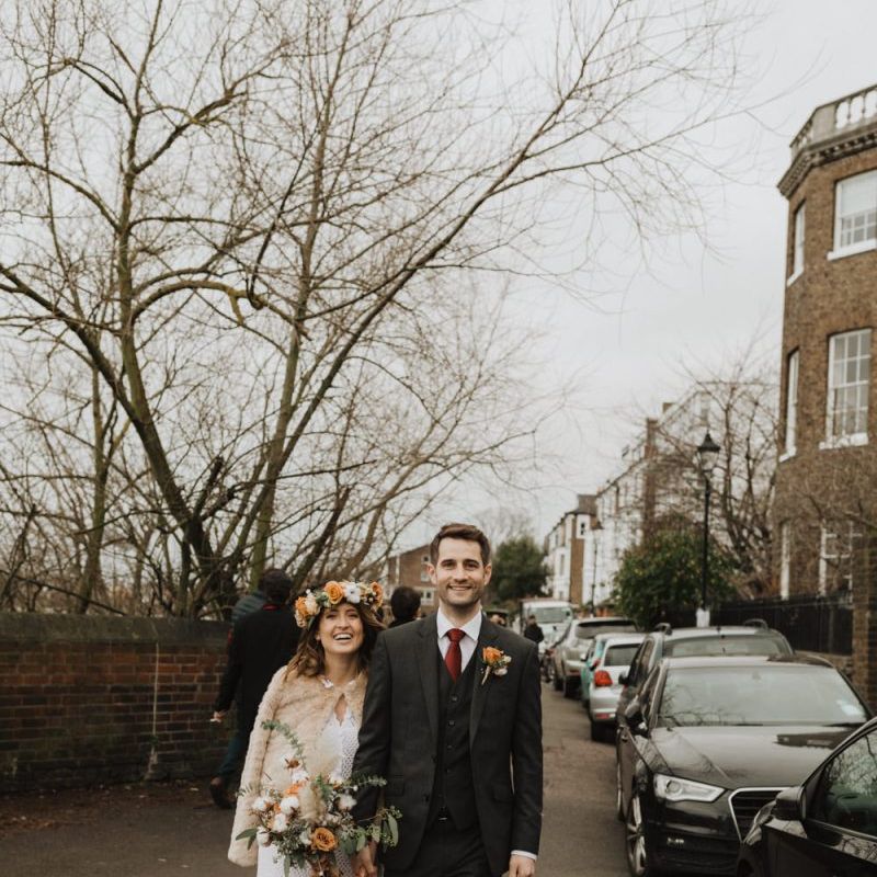 Winter wedding at Linden House in London with bride wearing beautiful floral crown and Groom in three piece suit