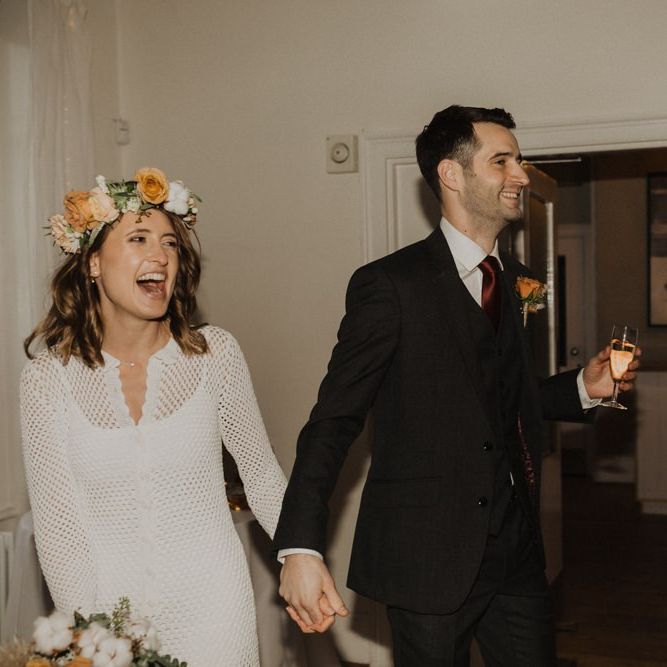 Bride and groom at Linden House for intimate wedding with modern boho styling  and floral crown