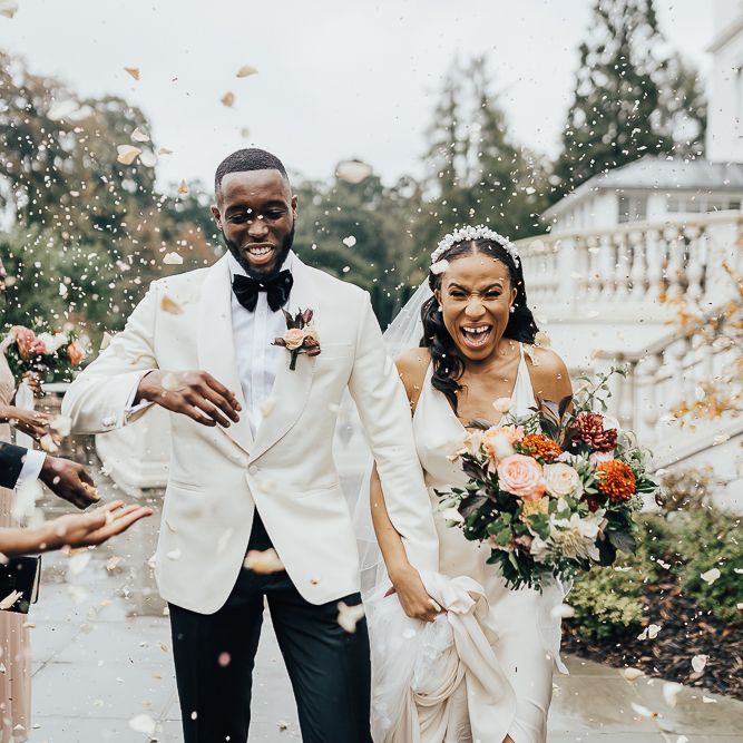 Confetti moment at Coworth Park black tie wedding