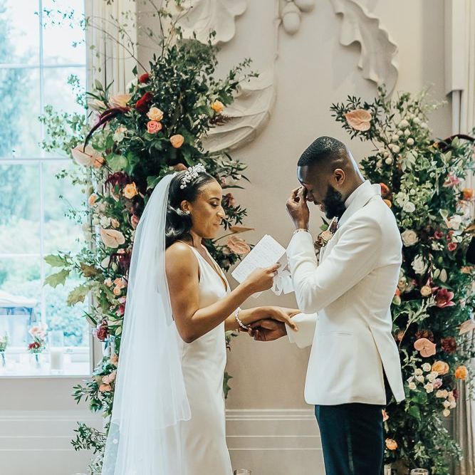 Emotional groom during the wedding ceremony at Coworth Park