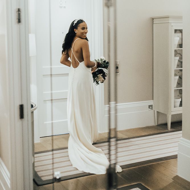 Bride in minimalist slip wedding dress from ASOS