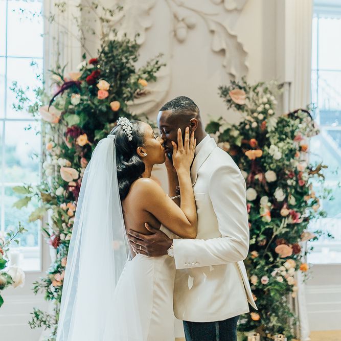 You may now kiss the bride moment at Coworth Park by Rebecca Carpenter Photography