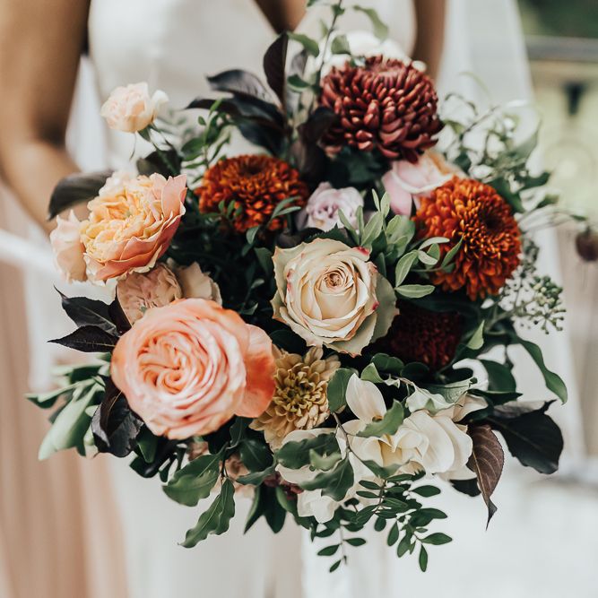 Autumn bridal bouquet with pinks, orange and green wedding flowers
