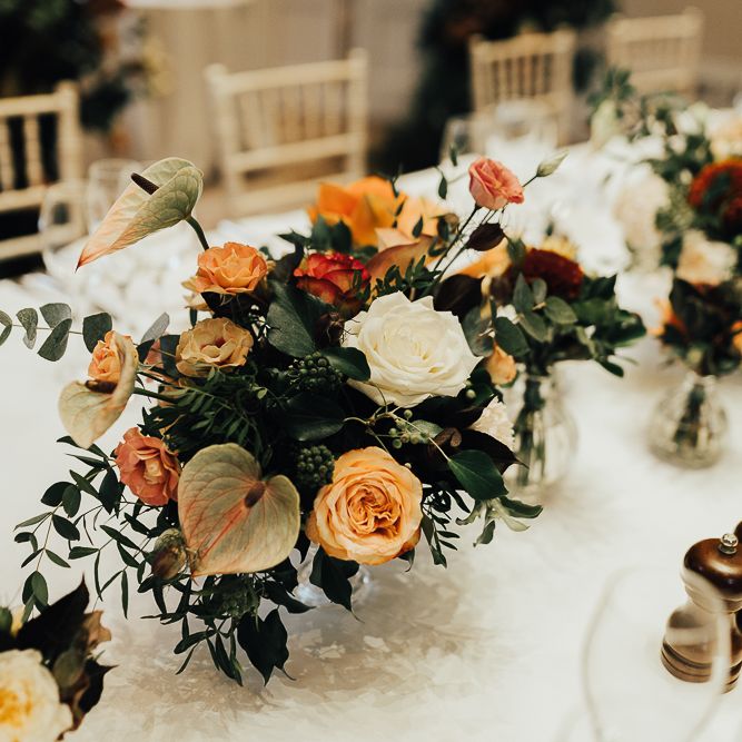 Autumn wedding flowers with roses, anthuriums and foliage