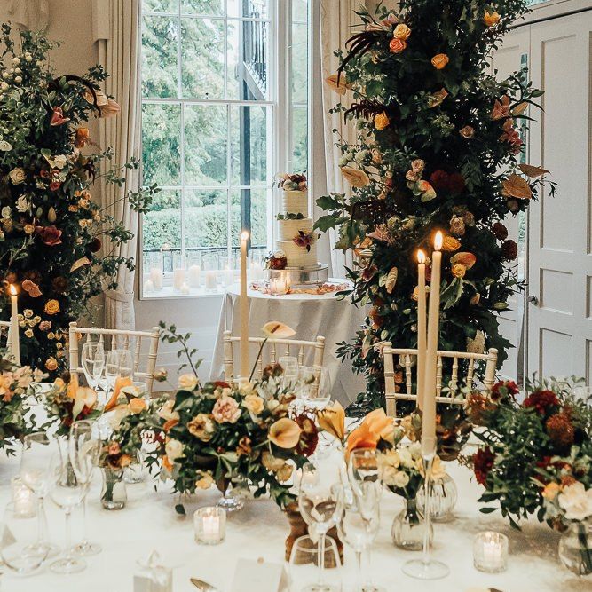 Intimate wedding reception with autumn flowers and candlelight