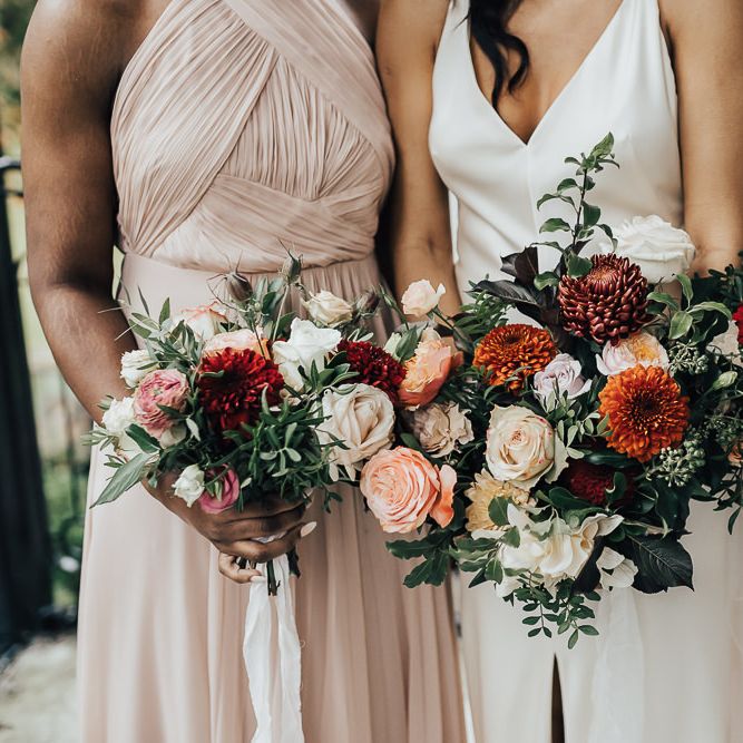 Autumn wedding bouquets with dahlias, roses and foliage
