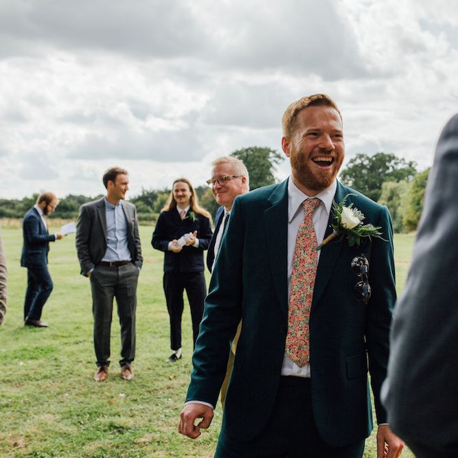 Bride in Paul Smith Suit | Outdoor Wedding Ceremony &amp; Tipi Reception Planned by Benessamy Events | Red on Blonde Photography