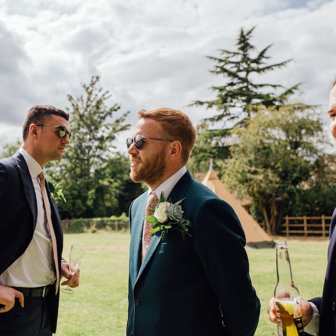 Groom in Paul Smith Suit &amp; Liberty Print Tie | Outdoor Wedding Ceremony &amp; Tipi Reception Planned by Benessamy Events | Red on Blonde Photography