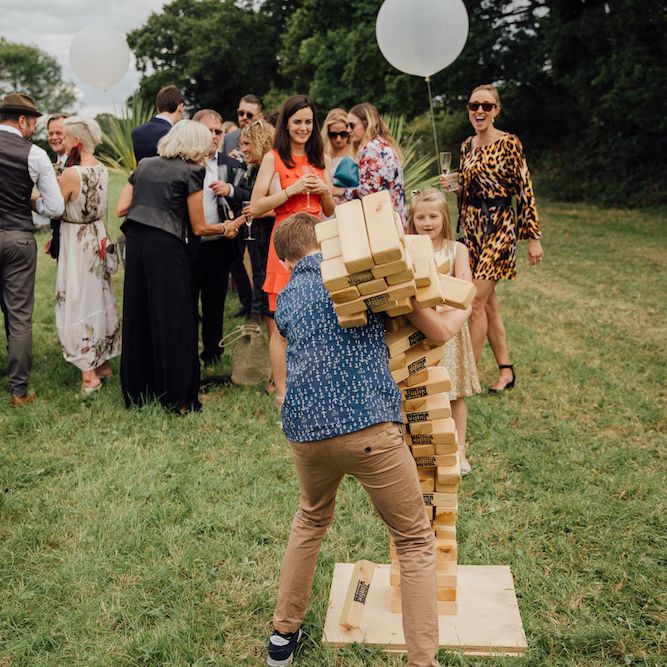 Giant Jenga Bridal Games | Outdoor Wedding Ceremony &amp; Tipi Reception Planned by Benessamy Events | Red on Blonde Photography