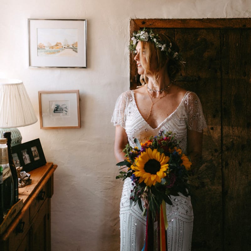 Bride in Jenny Packham Portia Wedding Dress Holding a Sunflower Wedding Bouquet