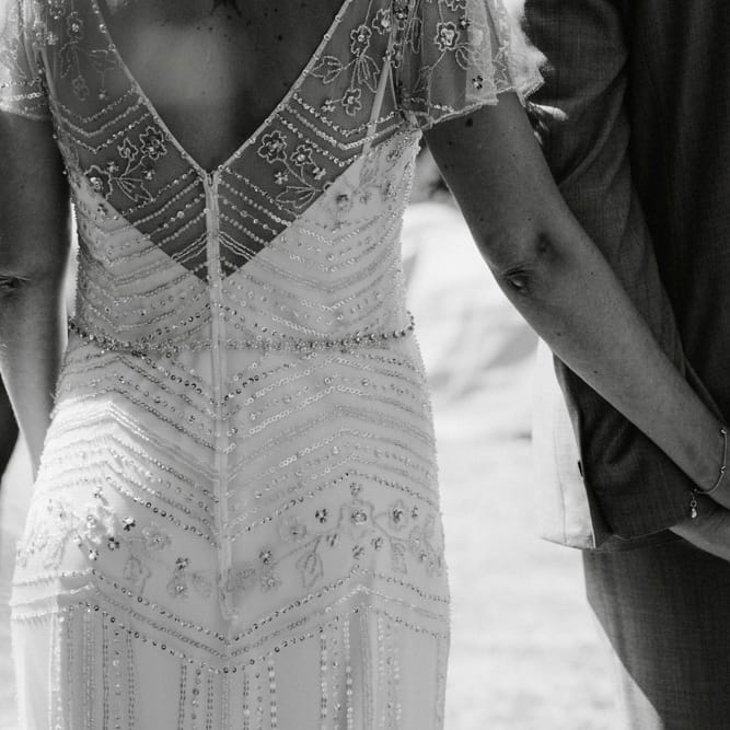 Bride in Jenny Packham Portia Wedding Dress and Groom Holding Hands