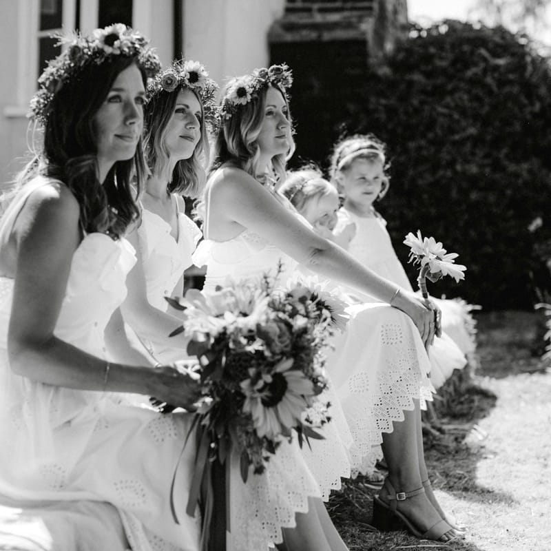 Bridesmaids in White Dresses and Flower Crowns