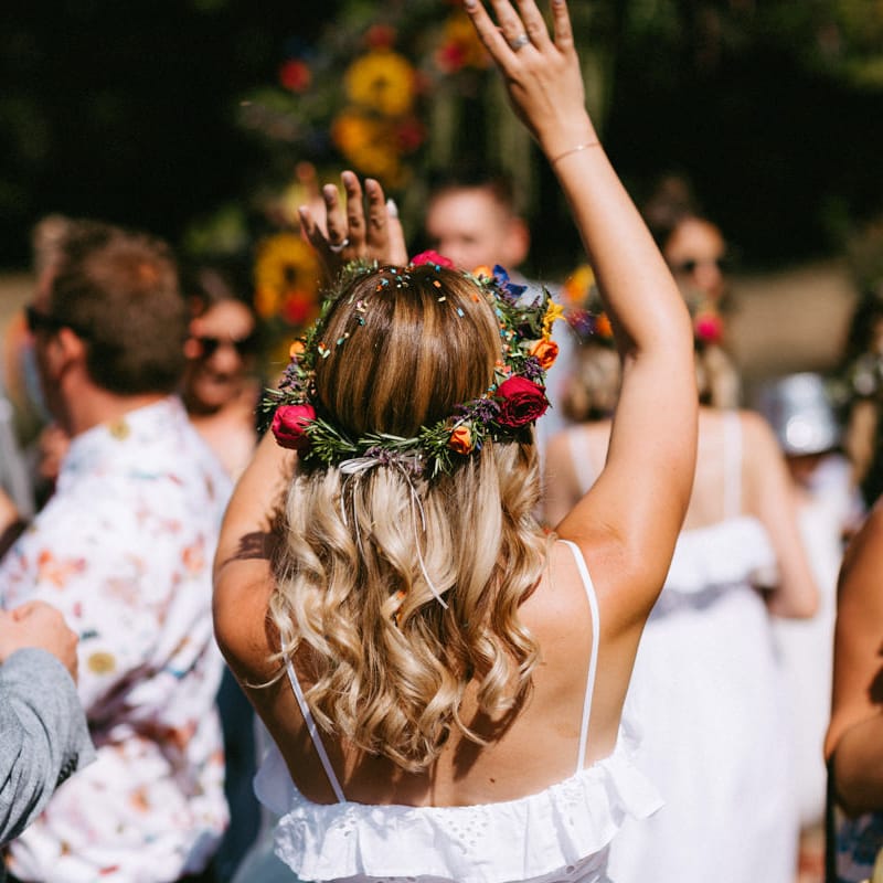 Bridesmaid with Wavy Hair, White Dress and Colourful Flower Crown