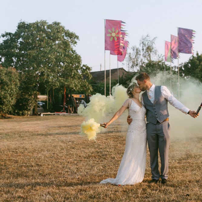 Smoke Bomb Portrait Bride in Jenny Packham Portia Wedding Dress and Flower Crown and Groom in Grey Ted Baker Suit