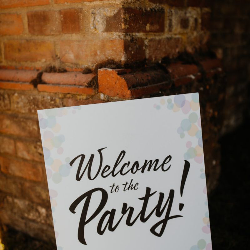 Personalised wedding sign with colourful hanging lanterns decor