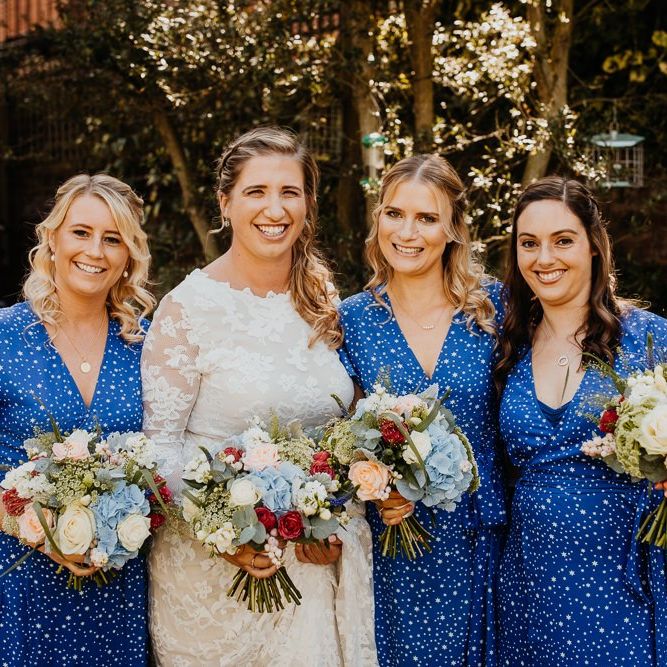 Bride and her bridesmaids wearing star print dresses and bright floral bouquets